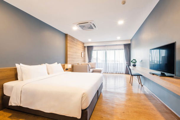 Executive King Room with private balcony and Chiang Mai city skyline views at Icon Park Hotel