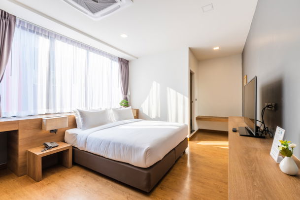 Bright Premier Corner Room with floor-to-ceiling windows and minimalist interior design